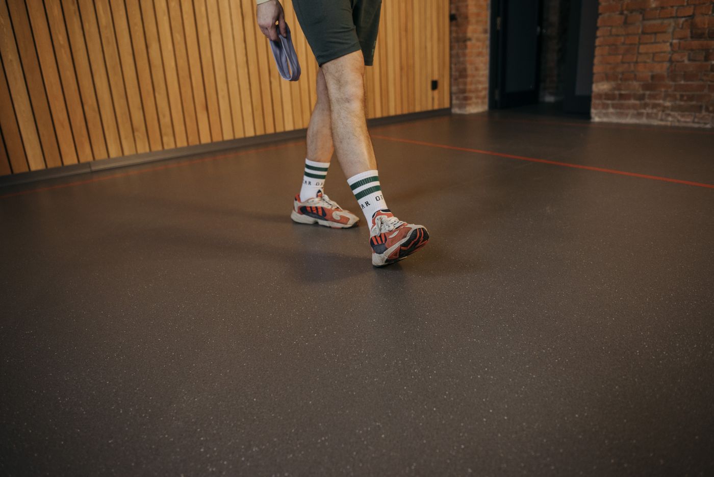 Example photograph of an epoxy floor running wall to wall with no joints or grout lines, shown to illustrate the finish rather than a Gargus Wood Floors job.