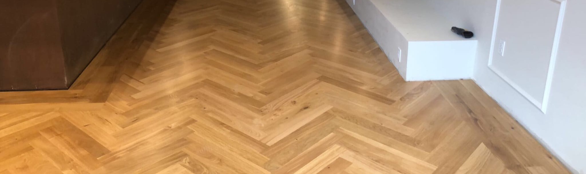 White oak herringbone flooring laid through a hallway in Southern Oregon