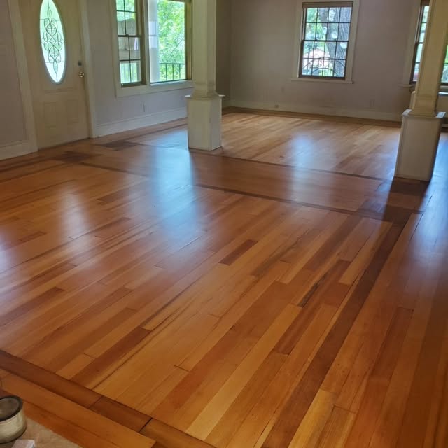 Wide plank hardwood boards running the length of a room.